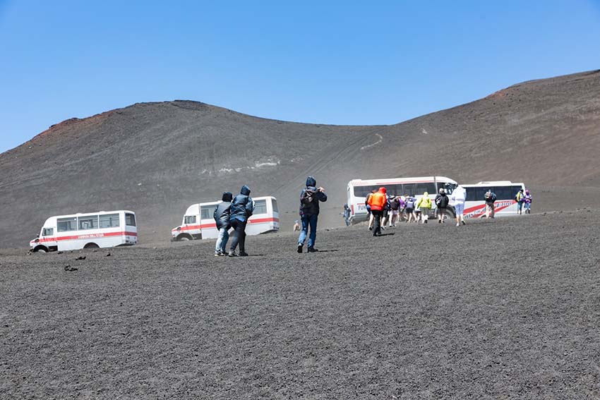 MOUNT ETNA, ITALY - MAY 23: Landrovers ands tourists visiting the vulcano of Mount Etna on May 23, 2016 at the island Sicily, Italy